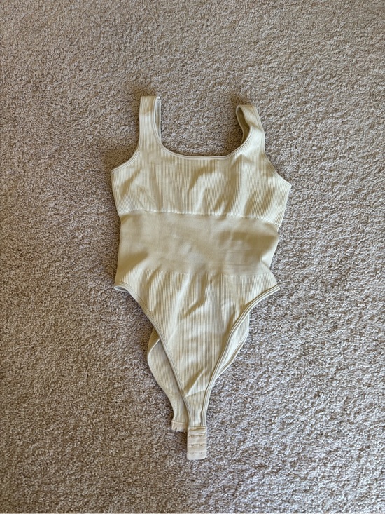 Tops - Cream Ribbed One-Piece Bodysuit